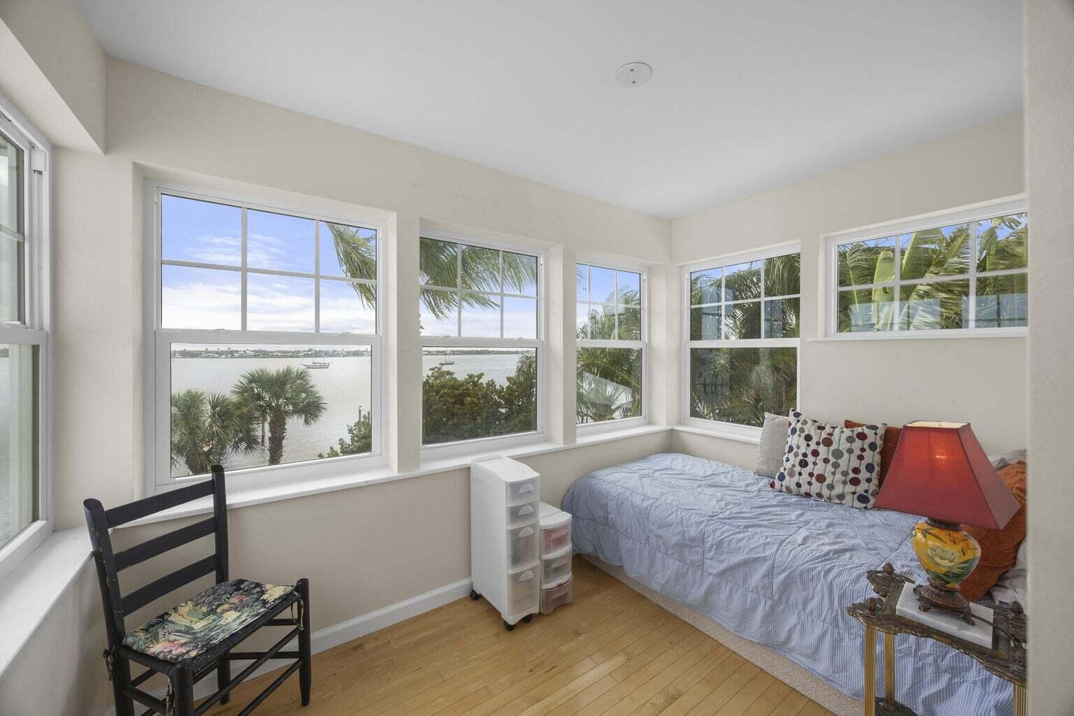 1009 Northwest Terrace Road Stuart, FL 34994 - Photo 49 of 69 a bedroom with a bed and wooden floor