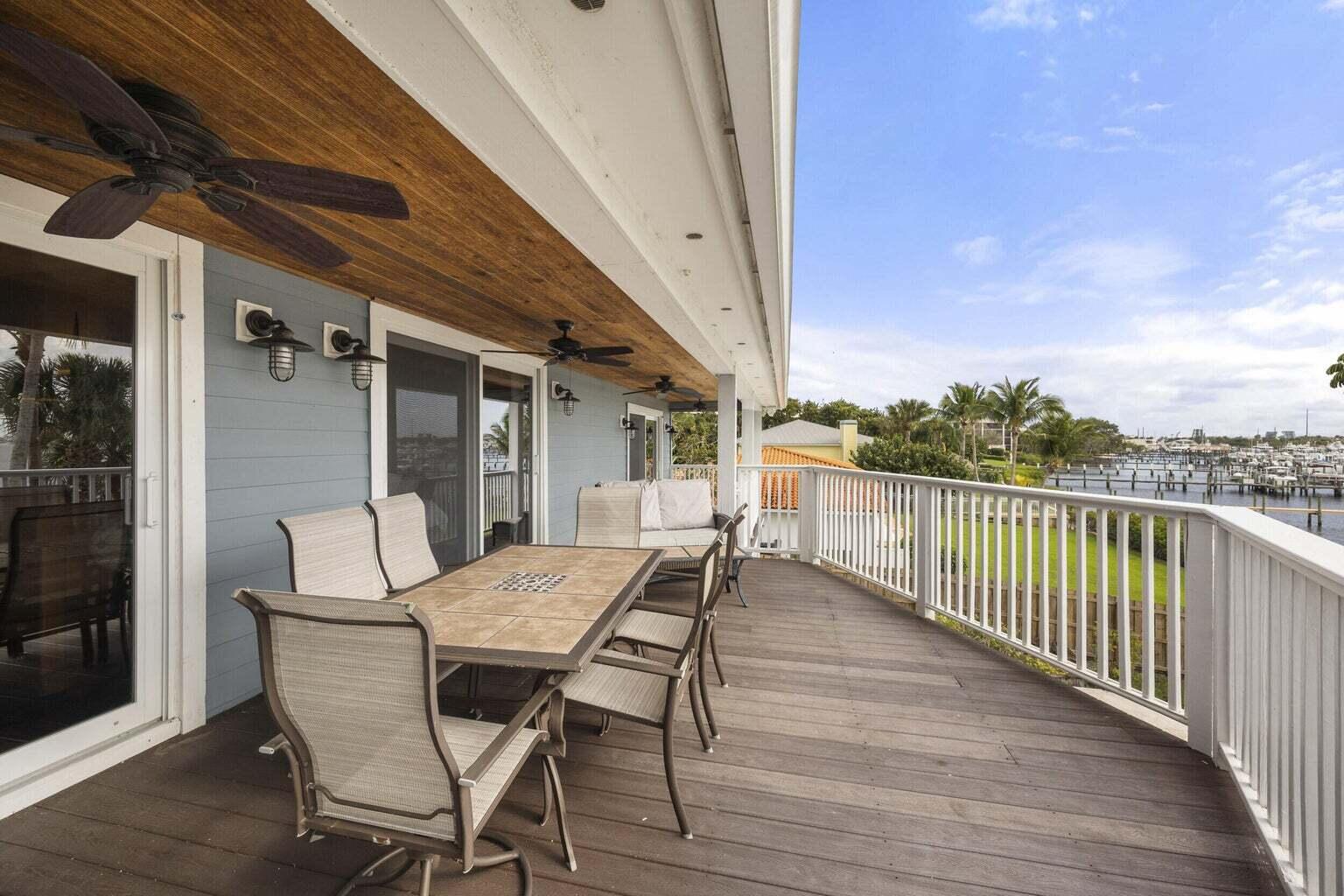 1009 Northwest Terrace Road Stuart, FL 34994 - Photo 55 of 69 a view of a patio with a table and chairs