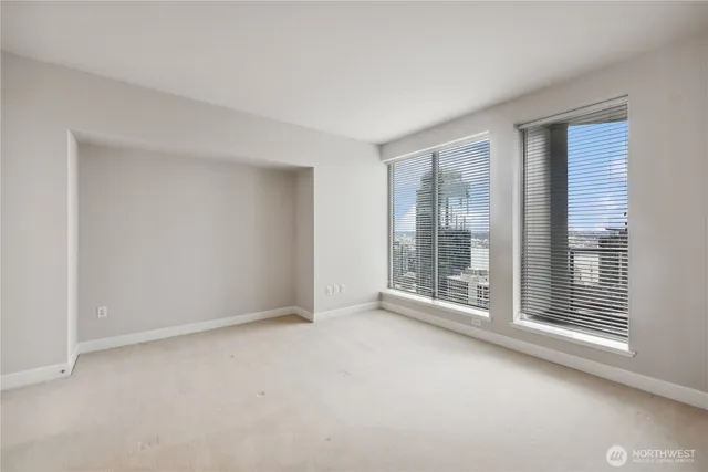 a view of an empty room with a window