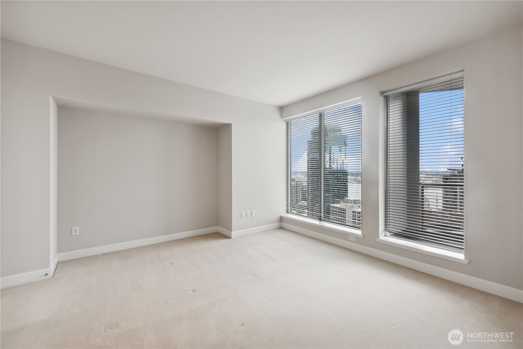 1920 4th Avenue, Unit 2702 Seattle, WA 98101 - Photo 30 of 40 a view of an empty room with a window