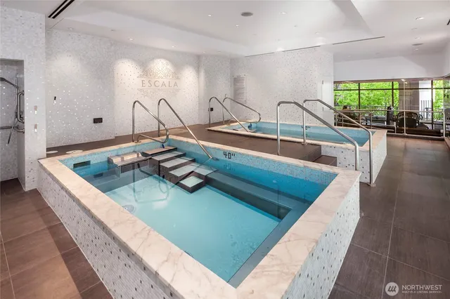 a kitchen with a sink and a view of living room