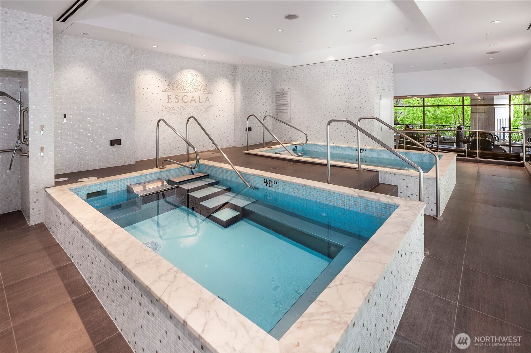 1920 4th Avenue, Unit 2702 Seattle, WA 98101 - Photo 32 of 40 a kitchen with a sink and a view of living room