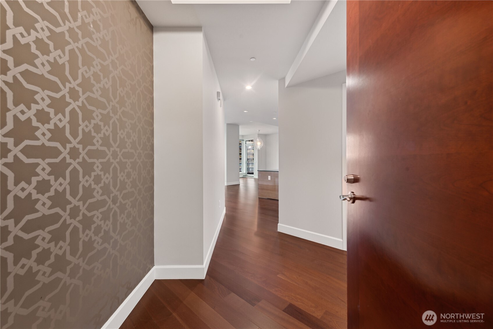 1920 4th Avenue, Unit 2702 Seattle, WA 98101 - Photo 4 of 40 a view of a hallway with wooden floor