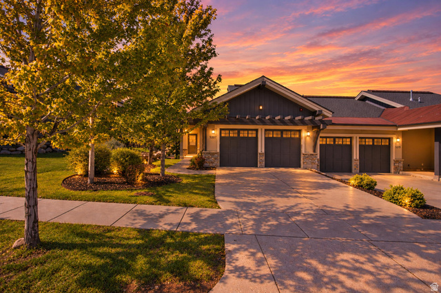 5207 North Oldgate Road Heber City, UT 84032 - Photo 1 of 58 Stone and siding exterior with multiple garage bays, an architectural shingle roof, and a mature landscaped yard with established trees