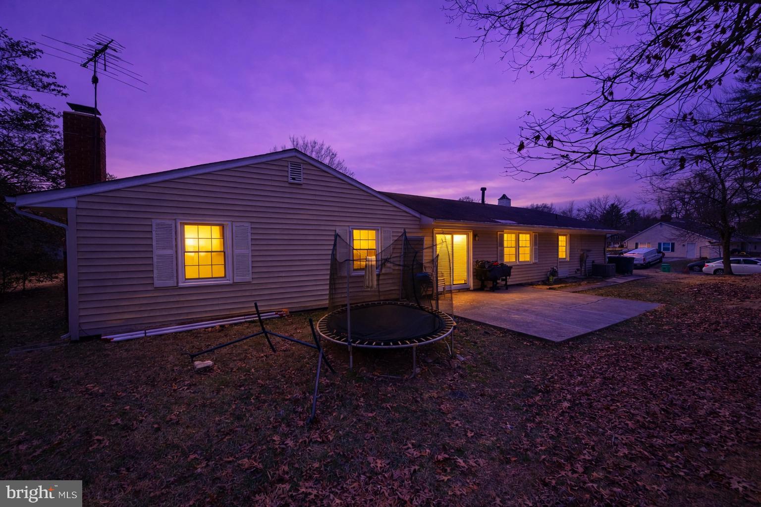 12600 Cedarbrook Lane Laurel, MD 20708 - Photo 3 of 15 a backyard of a house with yard fire pit and outdoor seating