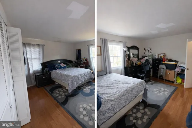 a bedroom with a bed and a mirror