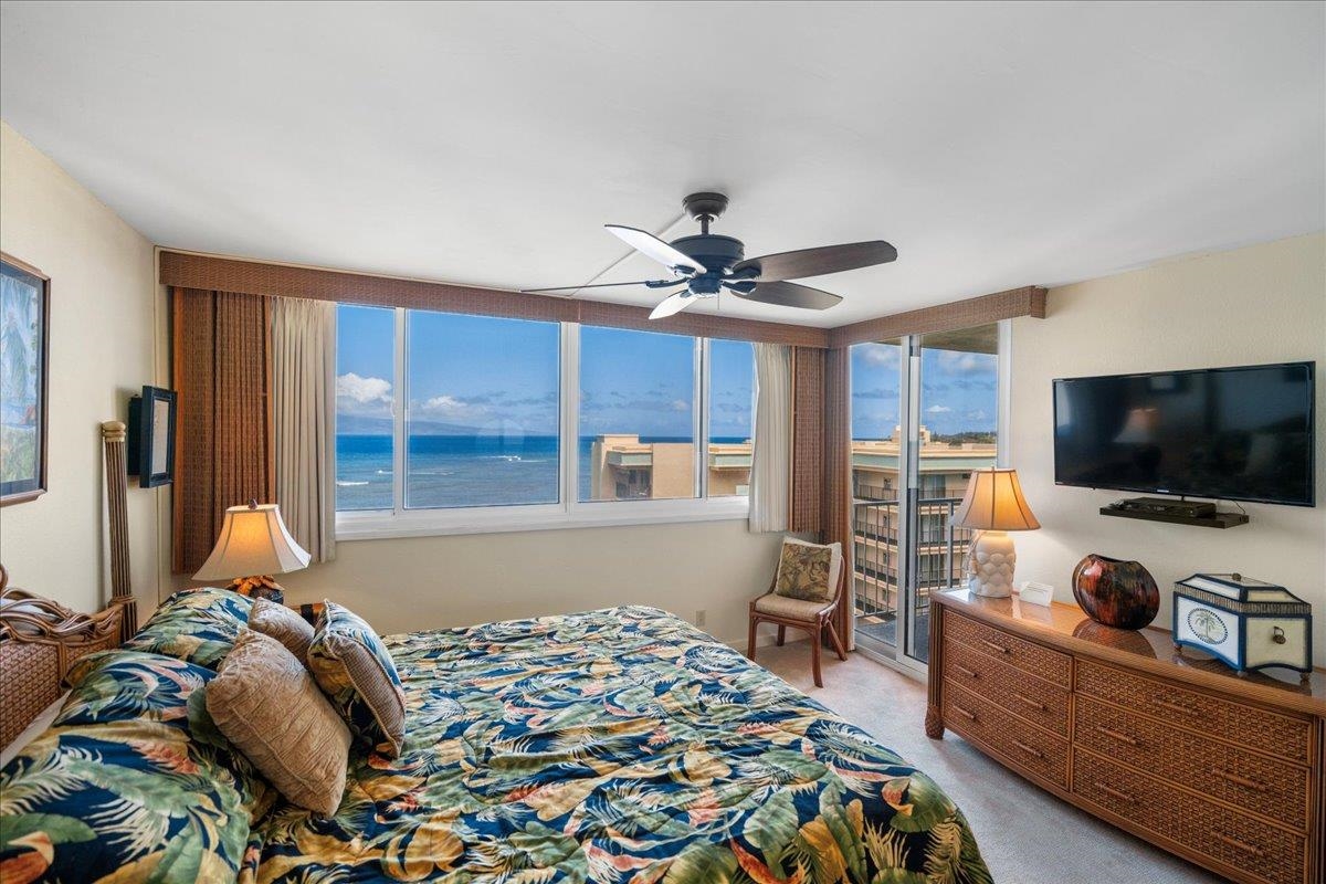 4365 Lower Honoapiilani Road, Unit 907 Lahaina, HI 96761 - Photo 15 of 23 a bedroom with a bed and a flat screen tv
