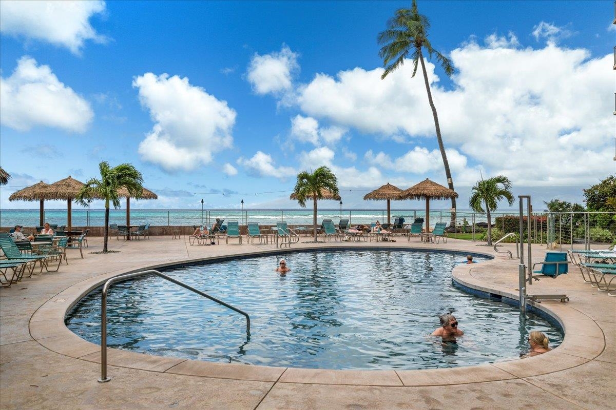 4365 Lower Honoapiilani Road, Unit 907 Lahaina, HI 96761 - Photo 20 of 23 a view of a swimming pool with a patio