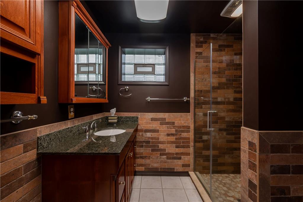 672 Great Belt Road Butler, PA 16002 - Photo 21 of 25 a bathroom with a sink and a mirror