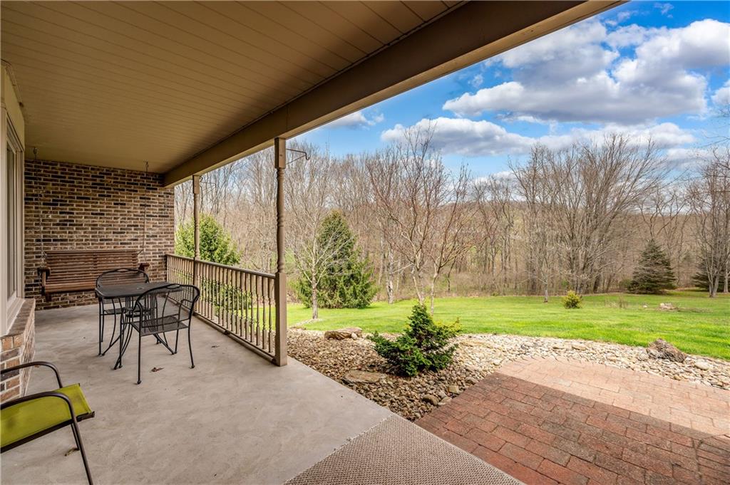672 Great Belt Road Butler, PA 16002 - Photo 3 of 25 a view of a porch with furniture and a yard
