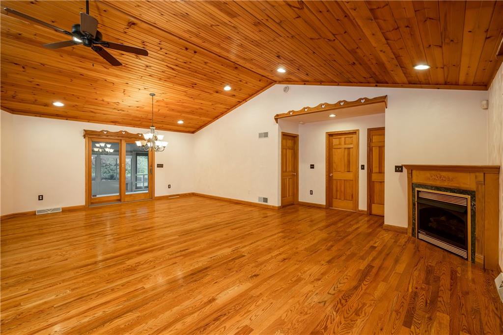 672 Great Belt Road Butler, PA 16002 - Photo 8 of 25 a view of empty room with wooden floor and fireplace