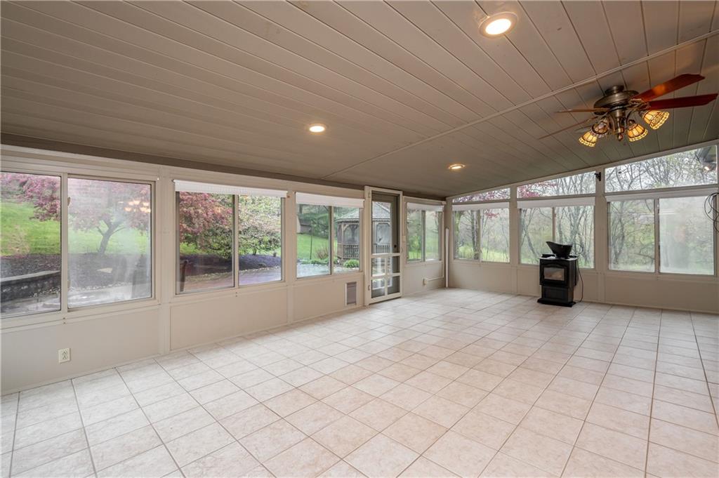 672 Great Belt Road Butler, PA 16002 - Photo 9 of 25 a large room with lots of large windows and chandelier