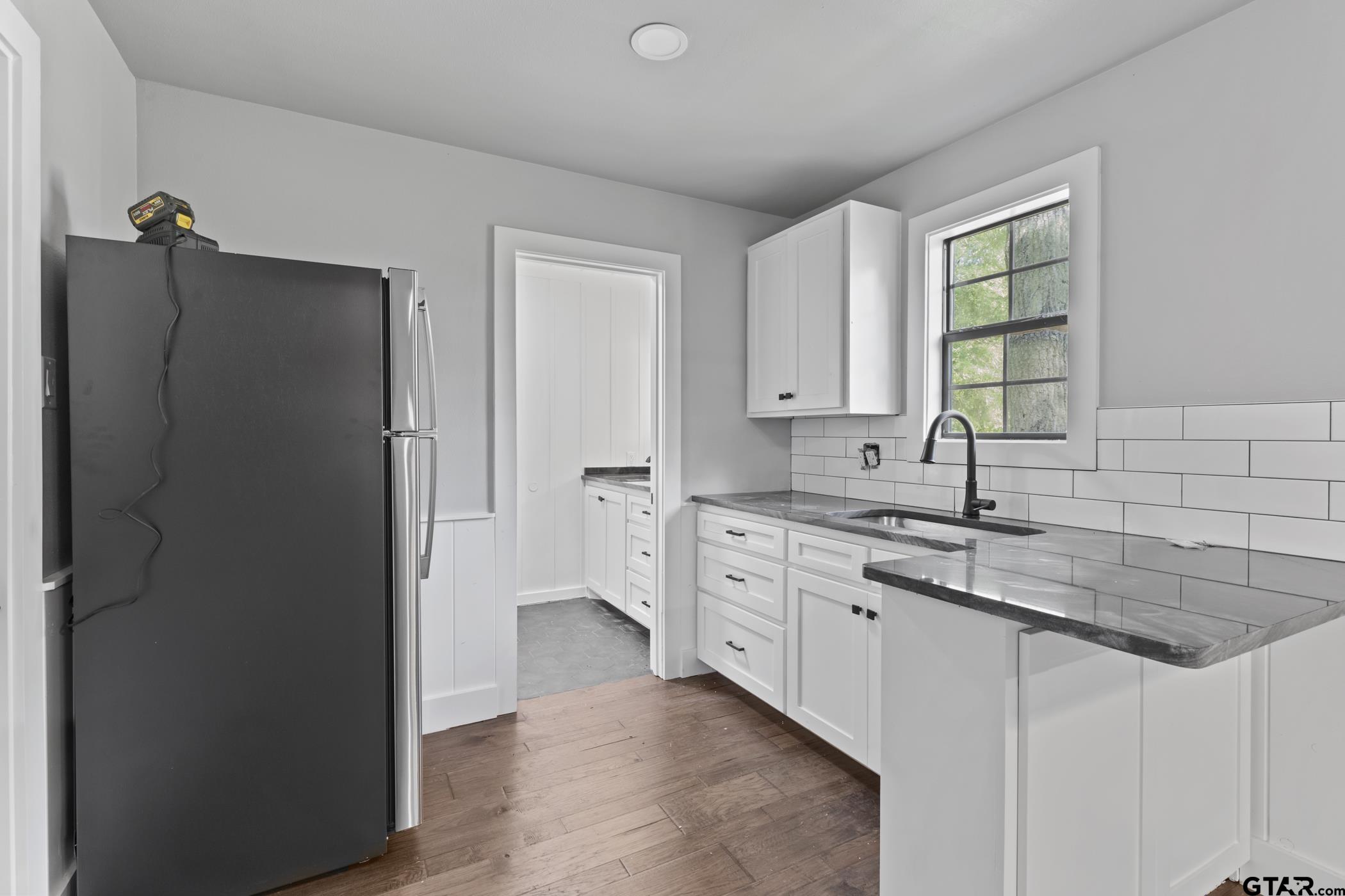18630 Eastside Road Troup, TX 75789 - Photo 10 of 47 a kitchen with stainless steel appliances granite countertop a refrigerator and a sink