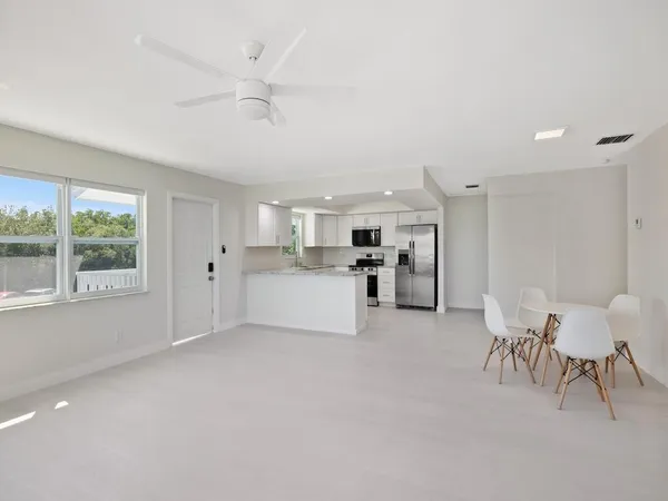 a view of a kitchen with granite countertop cabinets and sink