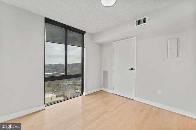 a view of an empty room and window