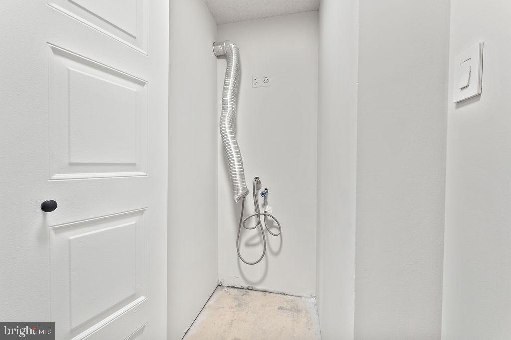 4500 South Four Mile Run Drive, Unit 1113 Arlington, VA 22204 - Photo 17 of 36 a bathroom with a glass shower door