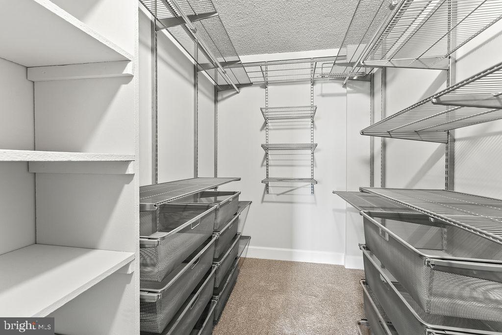 4500 South Four Mile Run Drive, Unit 1113 Arlington, VA 22204 - Photo 26 of 36 a kitchen with granite countertop a sink and stainless steel appliances