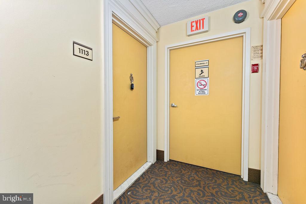 4500 South Four Mile Run Drive, Unit 1113 Arlington, VA 22204 - Photo 31 of 36 a view of a hallway to the door