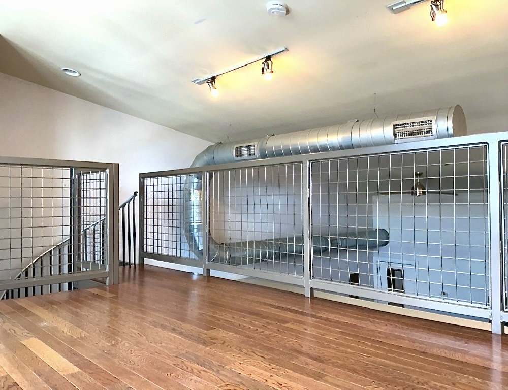 1601 East Cesar Chavez Street, Unit 306 Austin, TX 78702 - Photo 14 of 19 a view of empty room with wooden floor