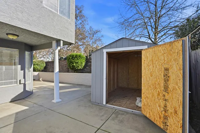 a view of a house with wooden floor and a small yard