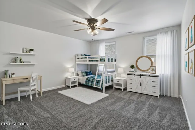 a living room with furniture windows and a chandelier