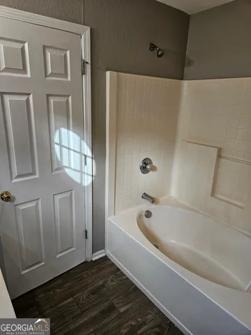 a bathroom with bathtub