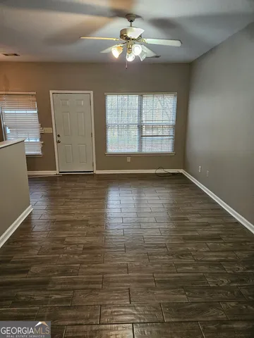 a view of an empty room with a window