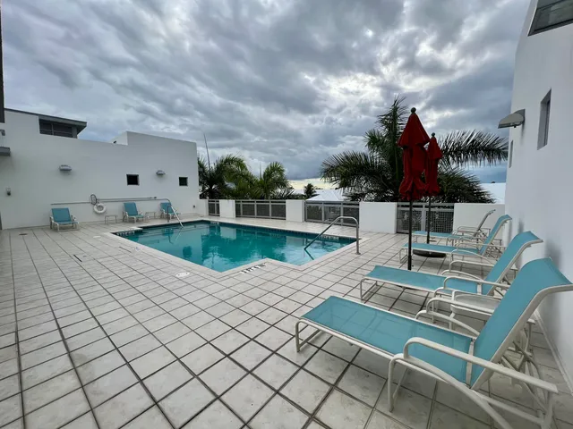 a sign that is sitting in front of flowers