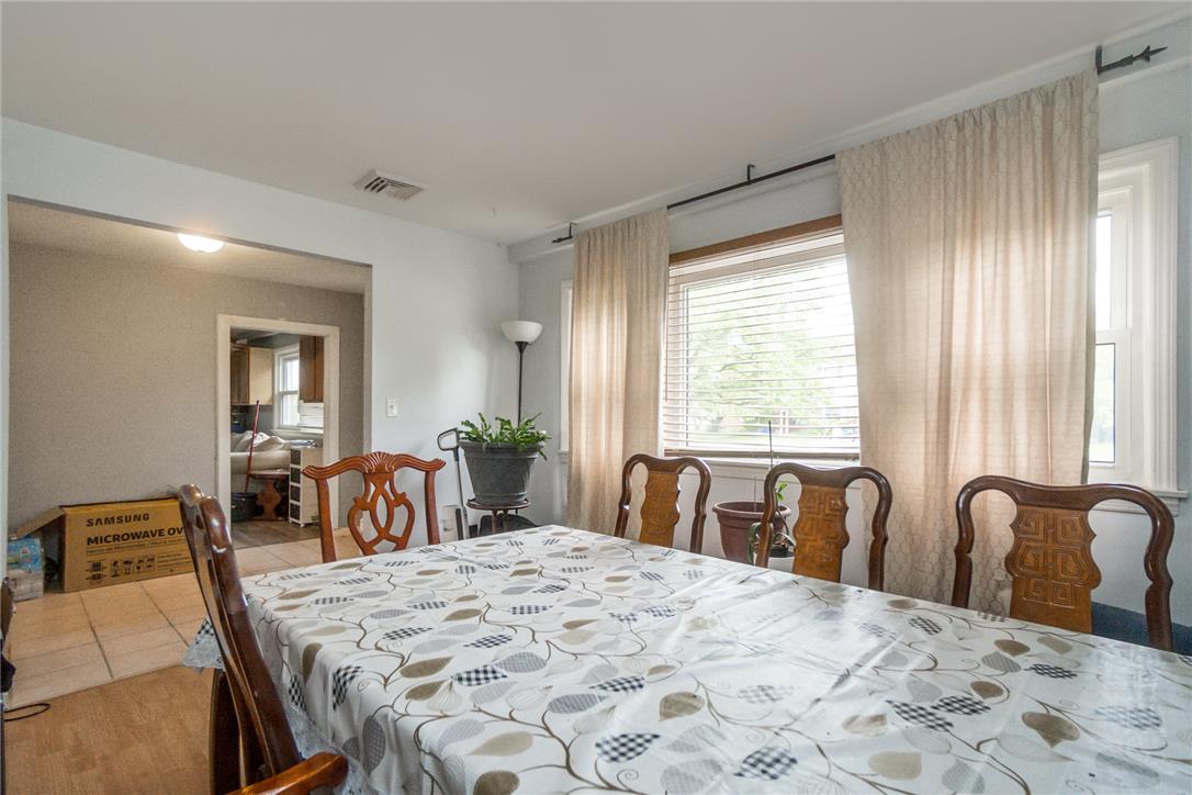 3031 Shakespeare Road Bethlehem, PA 18017 - Photo 5 of 30 A dedicated dining space, illuminated by natural light through expansive windows.