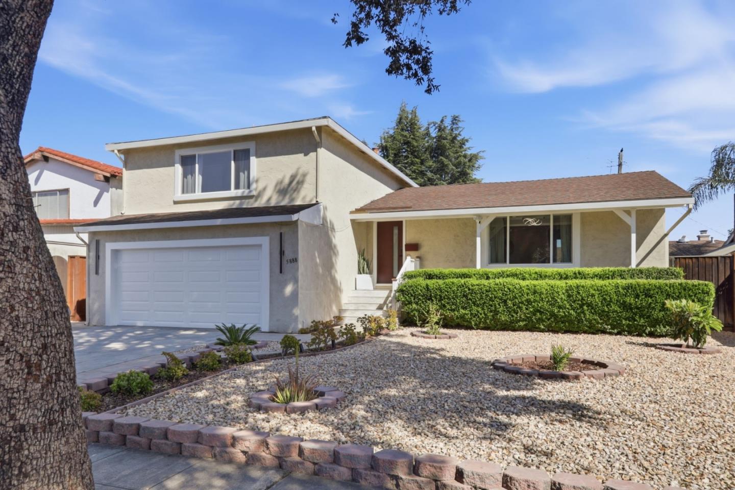 5888 Lean Way San Jose, CA 95123 - Photo 2 of 54 a front view of a house with a yard and potted plants