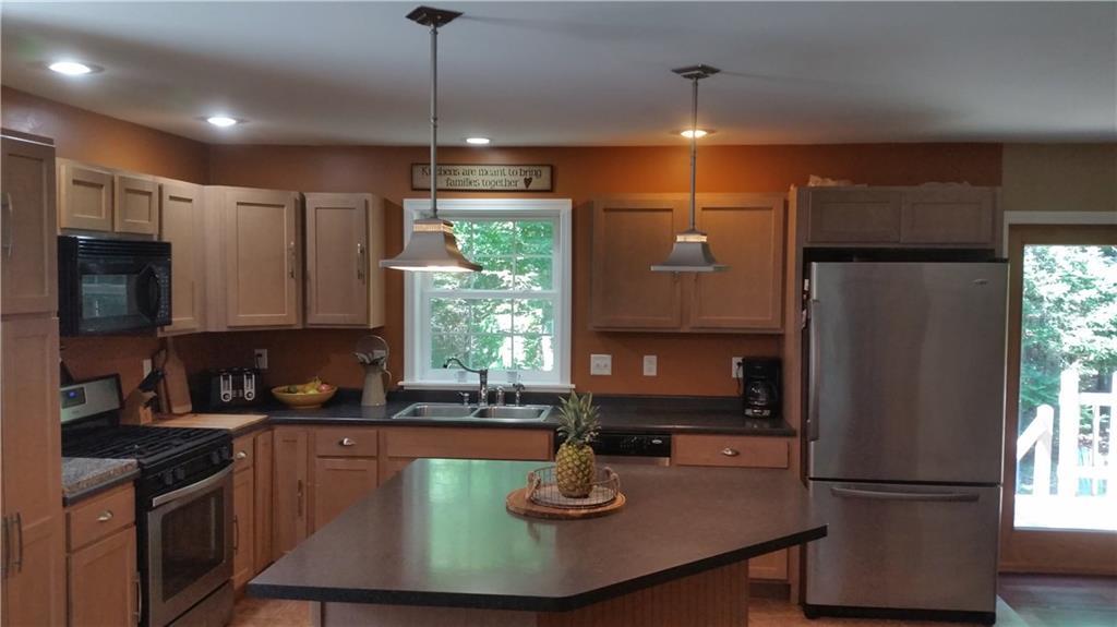 108 Clark Road Winterport, ME 04496 - Photo 10 of 34 Gas stove and stainless steel...