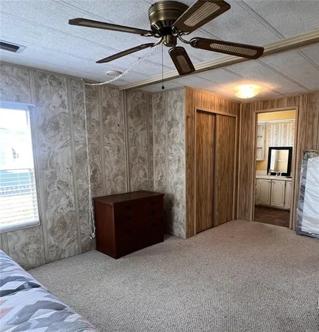 a big room with closet and windows