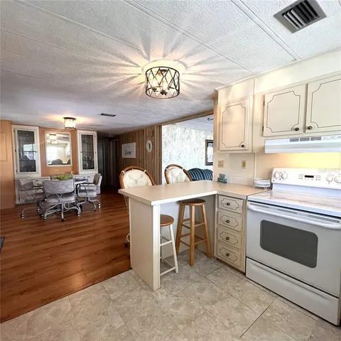 a view of a kitchen and dining room