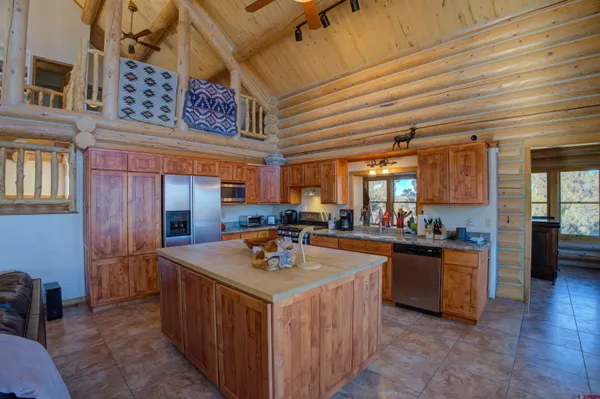 a kitchen with a stove a refrigerator and a stove