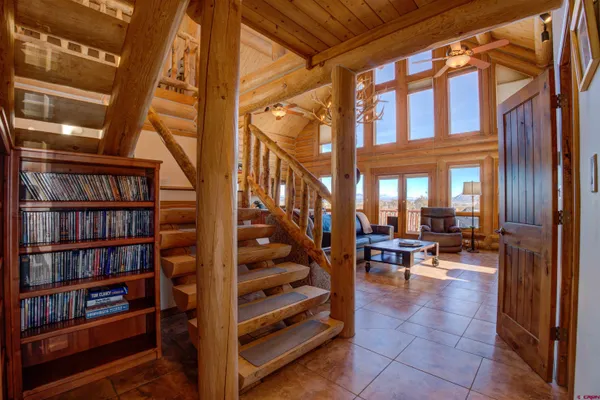a view of living room with furniture and book shelf
