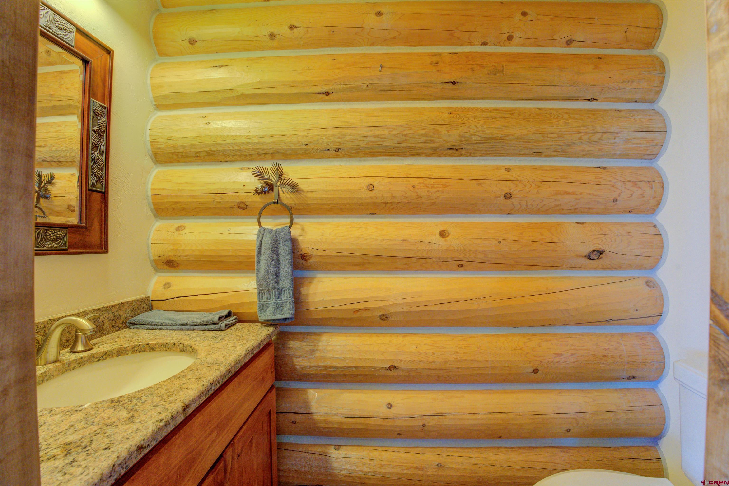 9619 Pueblo Ruins Road Cortez, CO 81321 - Photo 27 of 40 a bathroom with a granite countertop sink and a granite