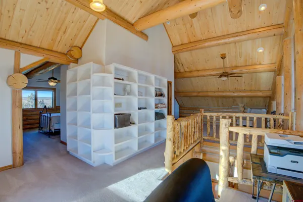 a view of entry way with wooden cabinet
