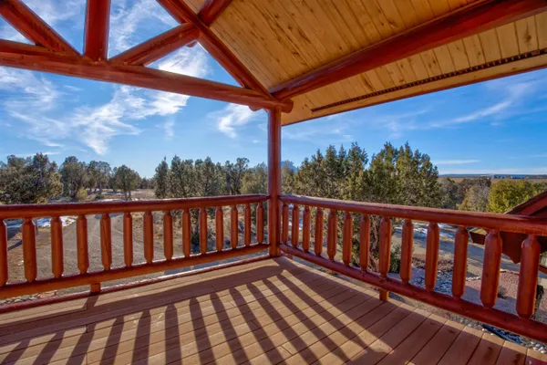 a balcony with wooden floor in outdoor space