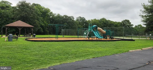 a view of a park with swings
