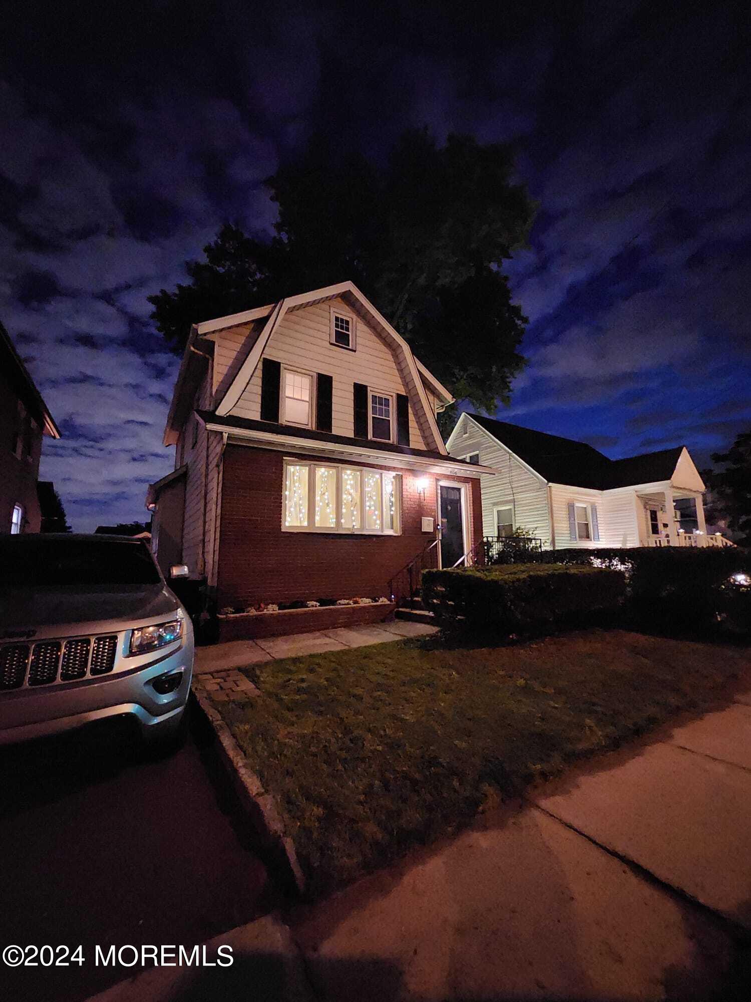 406 Rutherford Avenue Lyndhurst, NJ 07071 - Photo 2 of 5 a front view of a house with a yard