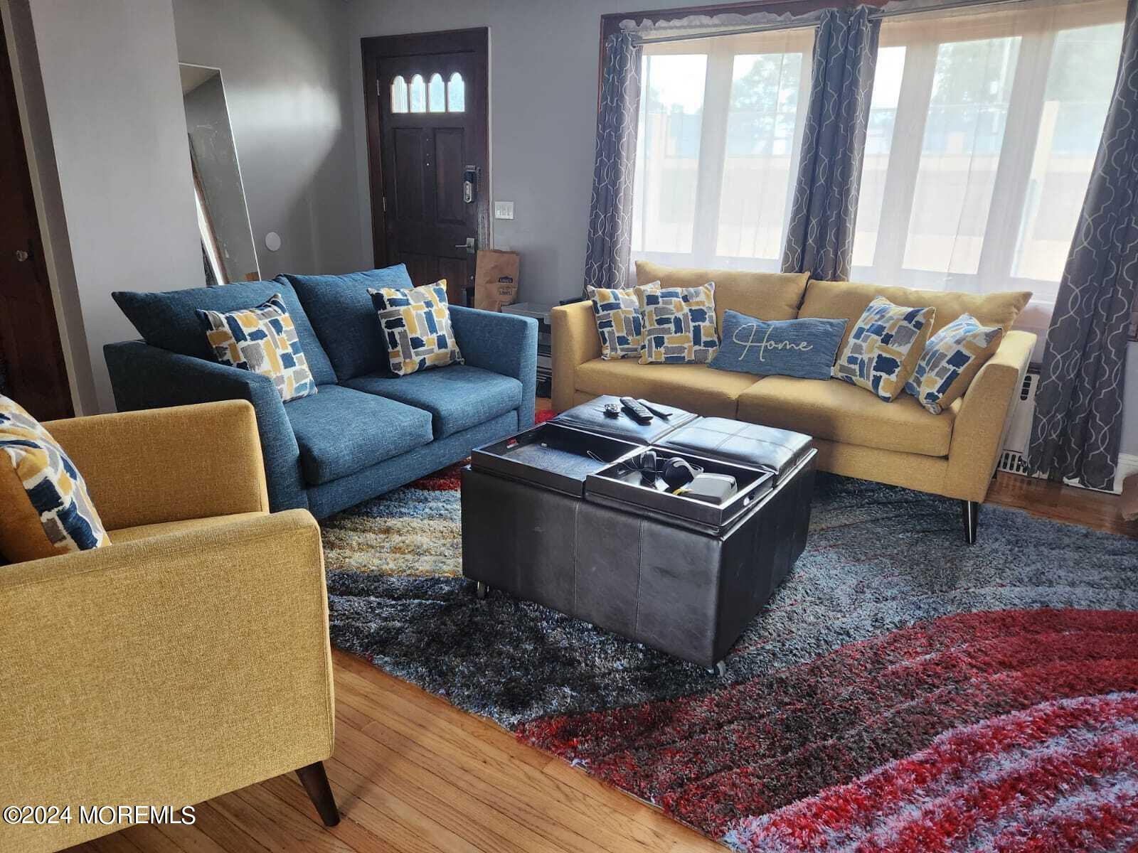 406 Rutherford Avenue Lyndhurst, NJ 07071 - Photo 4 of 5 a living room with furniture and a couch
