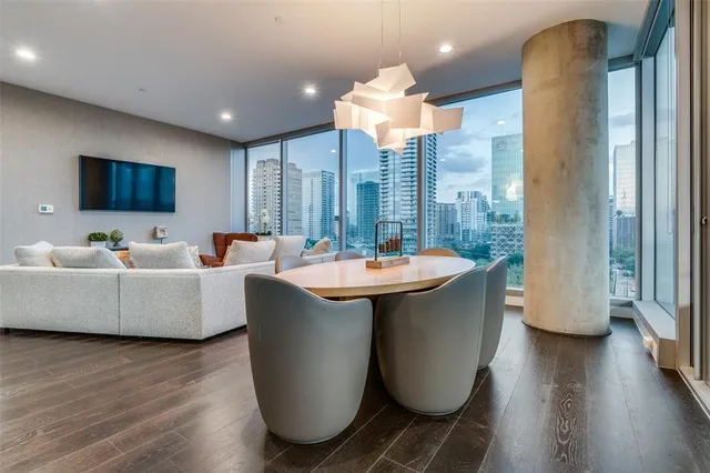a living room with couches and a flat screen tv