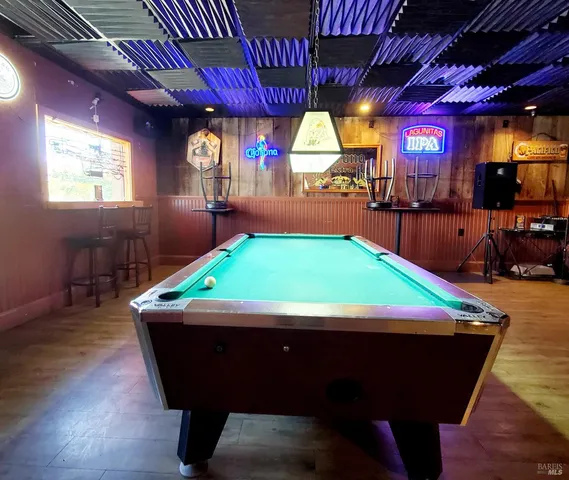a view of a empty room with a wooden floor