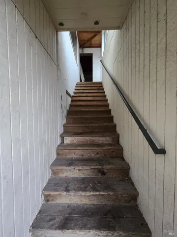 a kitchen with cabinets appliances and a sink