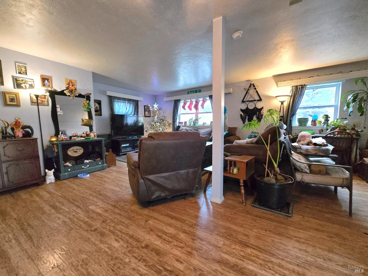 244 South Main Street Willits, CA 95490 - Photo 35 of 48 a living room with furniture and a wooden floor