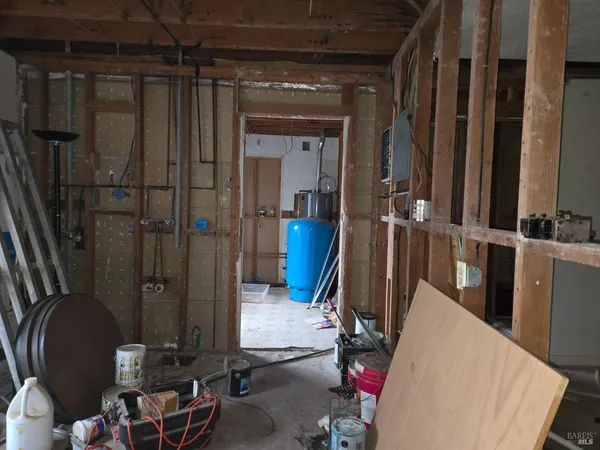 a room with furniture a air conditioner and a window