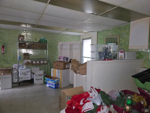 a view of a livingroom with an empty space and window