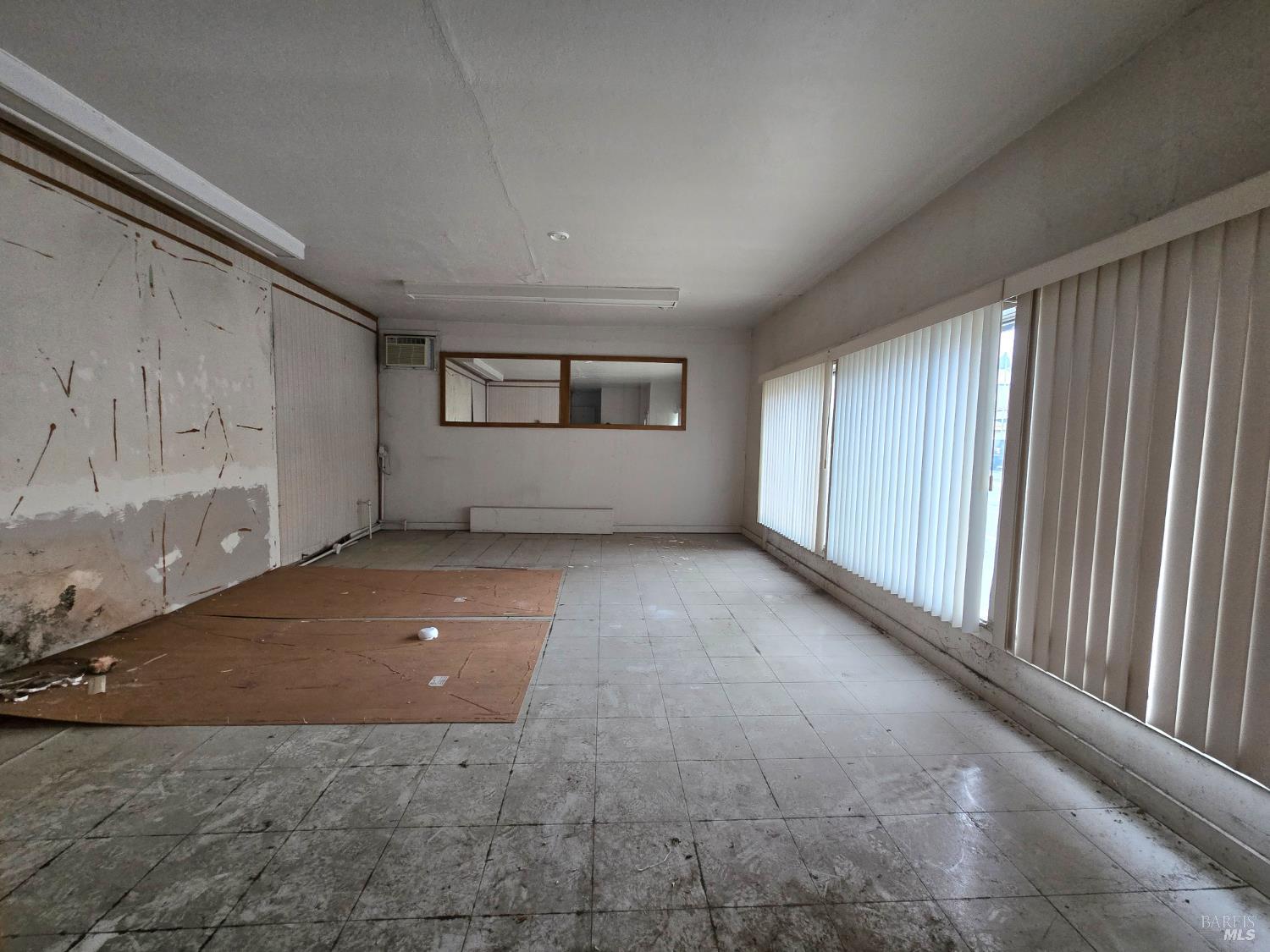 244 South Main Street Willits, CA 95490 - Photo 48 of 48 a view of a livingroom with an empty space and window