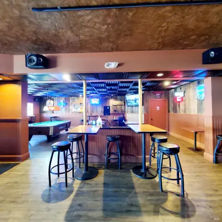 a dining room with a table and chairs