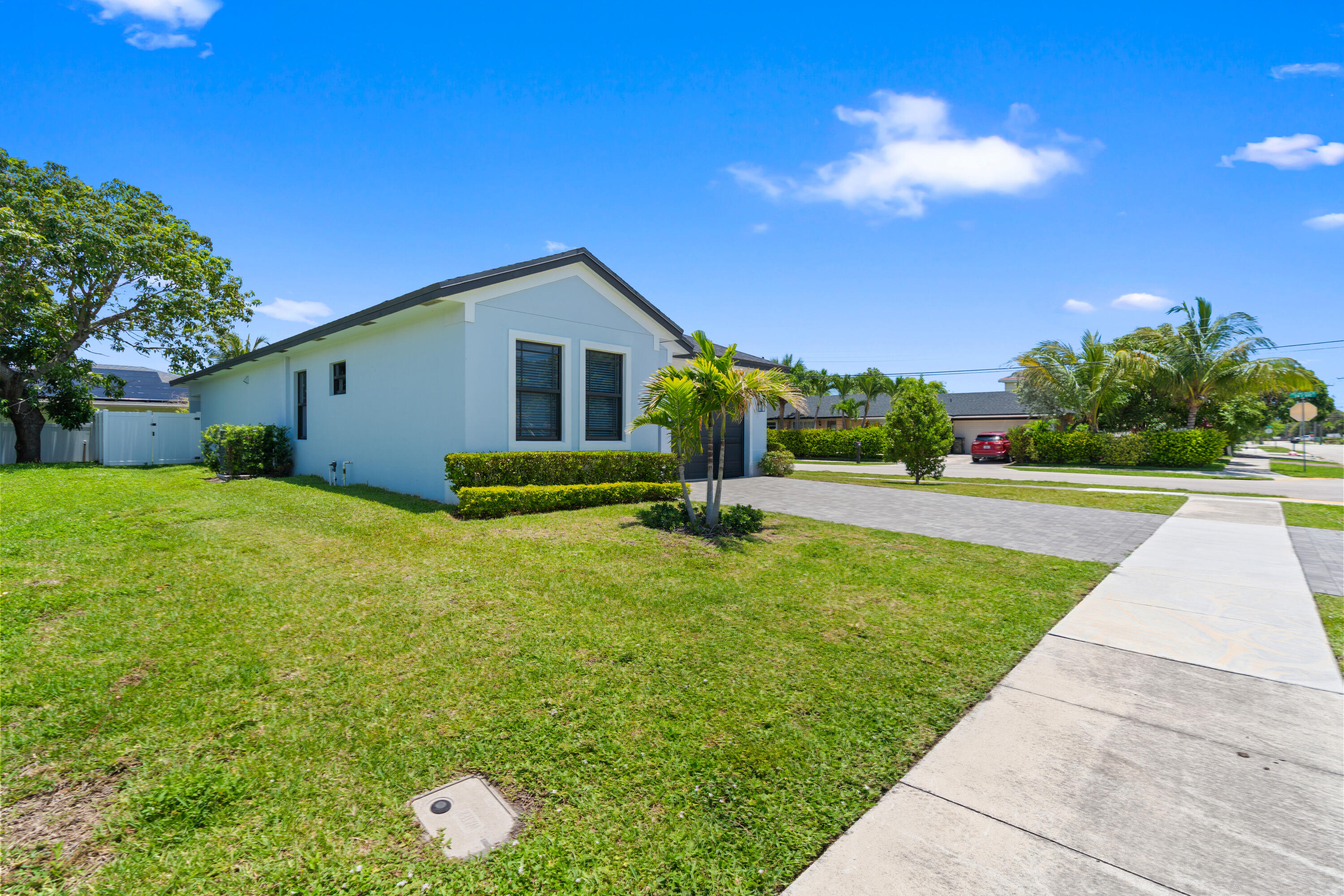 601 Southwest 3rd Street Delray Beach, FL 33444 - Photo 67 of 75 a front view of house with yard and green space